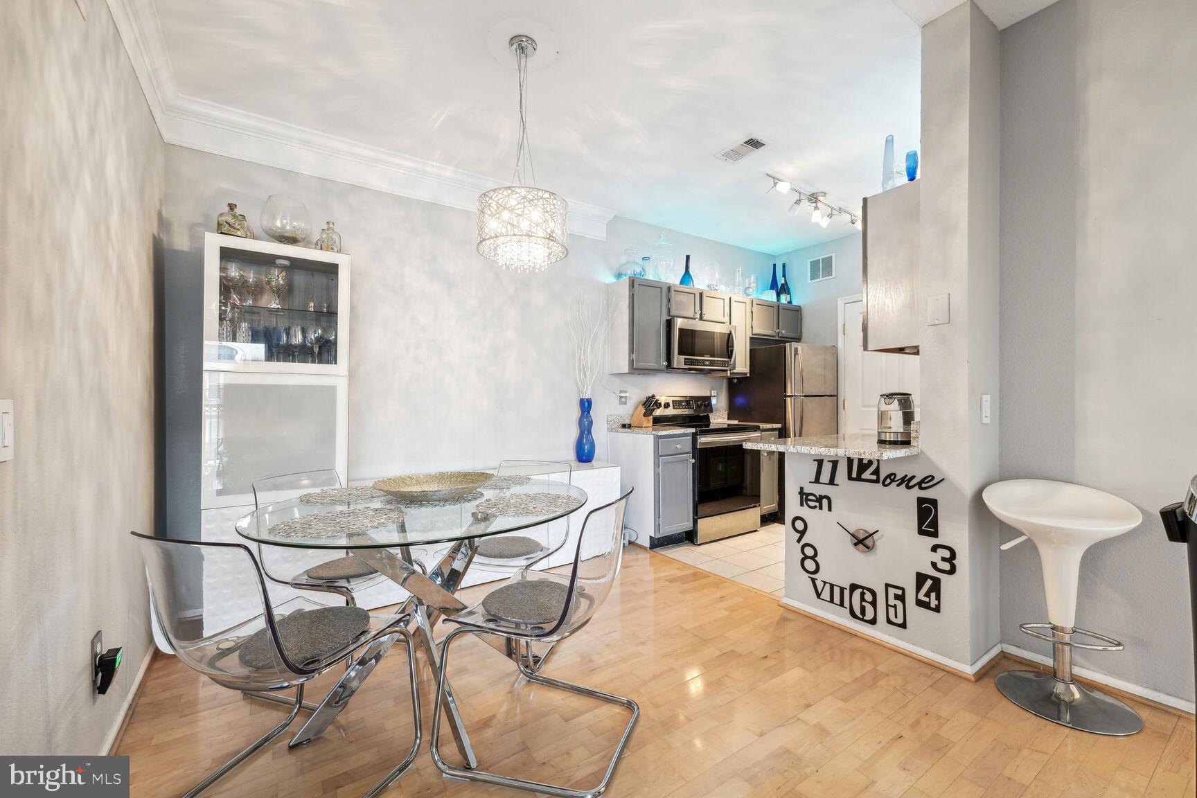 1581 Spring Gate Dr., Unit 5403 McLean, VA 22102 - Photo 5 of 20 a view of a kitchen and dining room