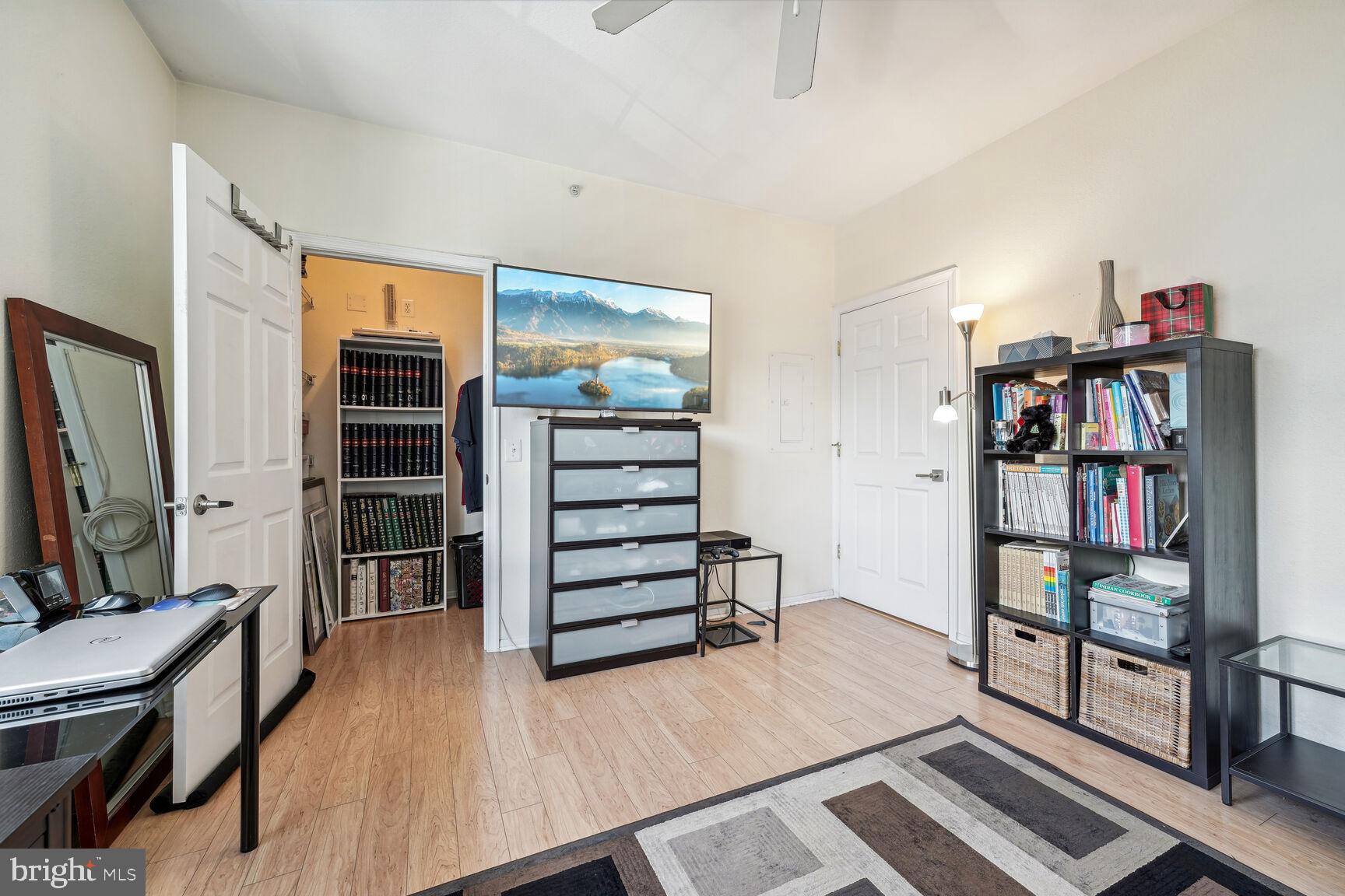 1581 Spring Gate Dr., Unit 5403 McLean, VA 22102 - Photo 10 of 20 a living room with furniture and a flat screen tv