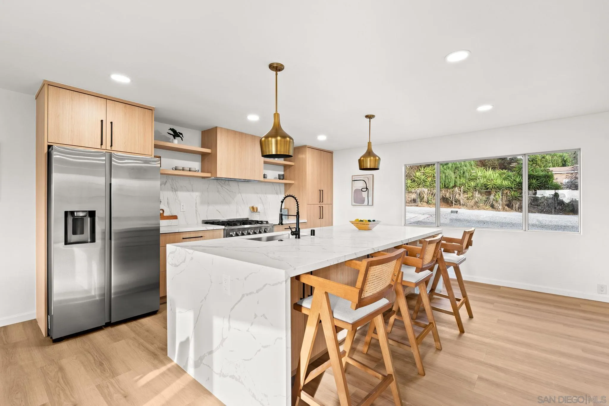 3110 Rio Madre Lane Jamul, CA 91935 - Photo 18 of 48 a kitchen with stainless steel appliances granite countertop a sink a stove a refrigerator and island with wooden floor