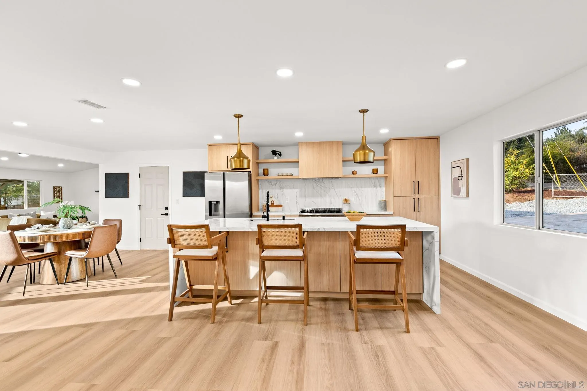 3110 Rio Madre Lane Jamul, CA 91935 - Photo 19 of 48 a view of a dining room with furniture and wooden floor
