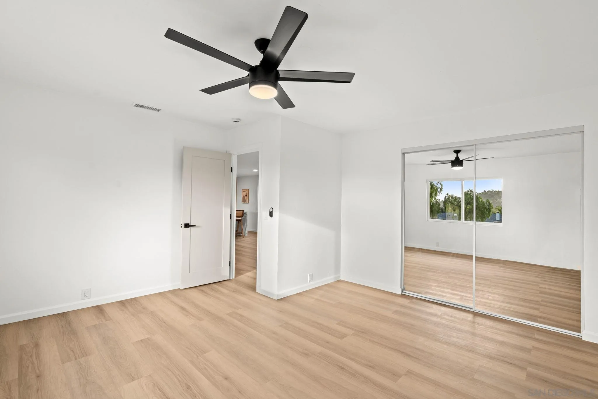 3110 Rio Madre Lane Jamul, CA 91935 - Photo 23 of 48 a view of a big room with wooden floor and windows