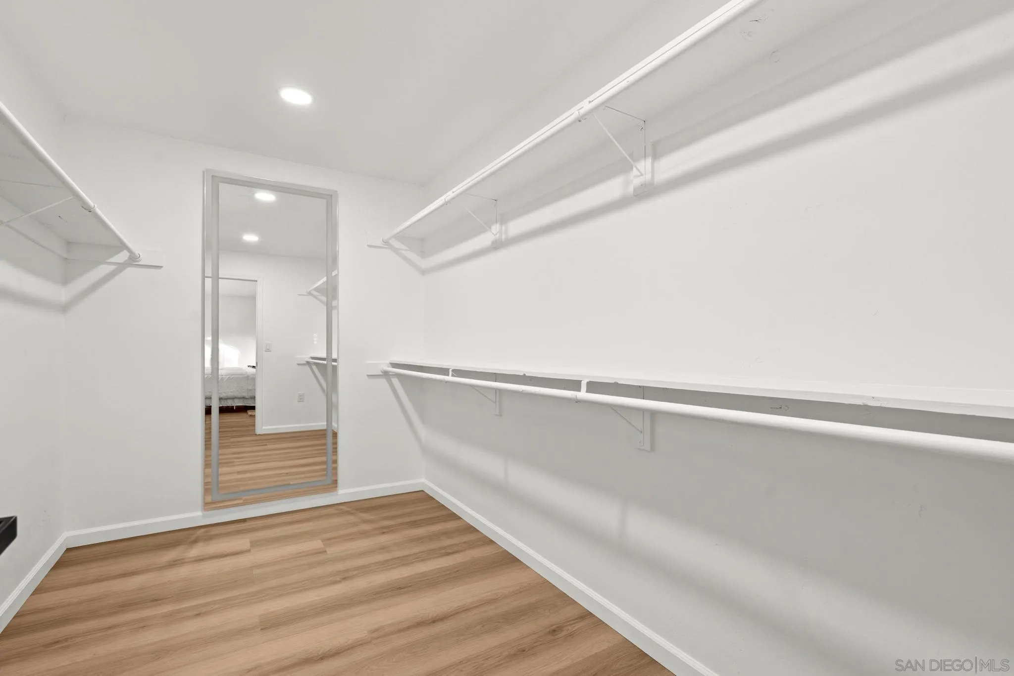 3110 Rio Madre Lane Jamul, CA 91935 - Photo 29 of 48 a view of a room with wooden floor and white walls