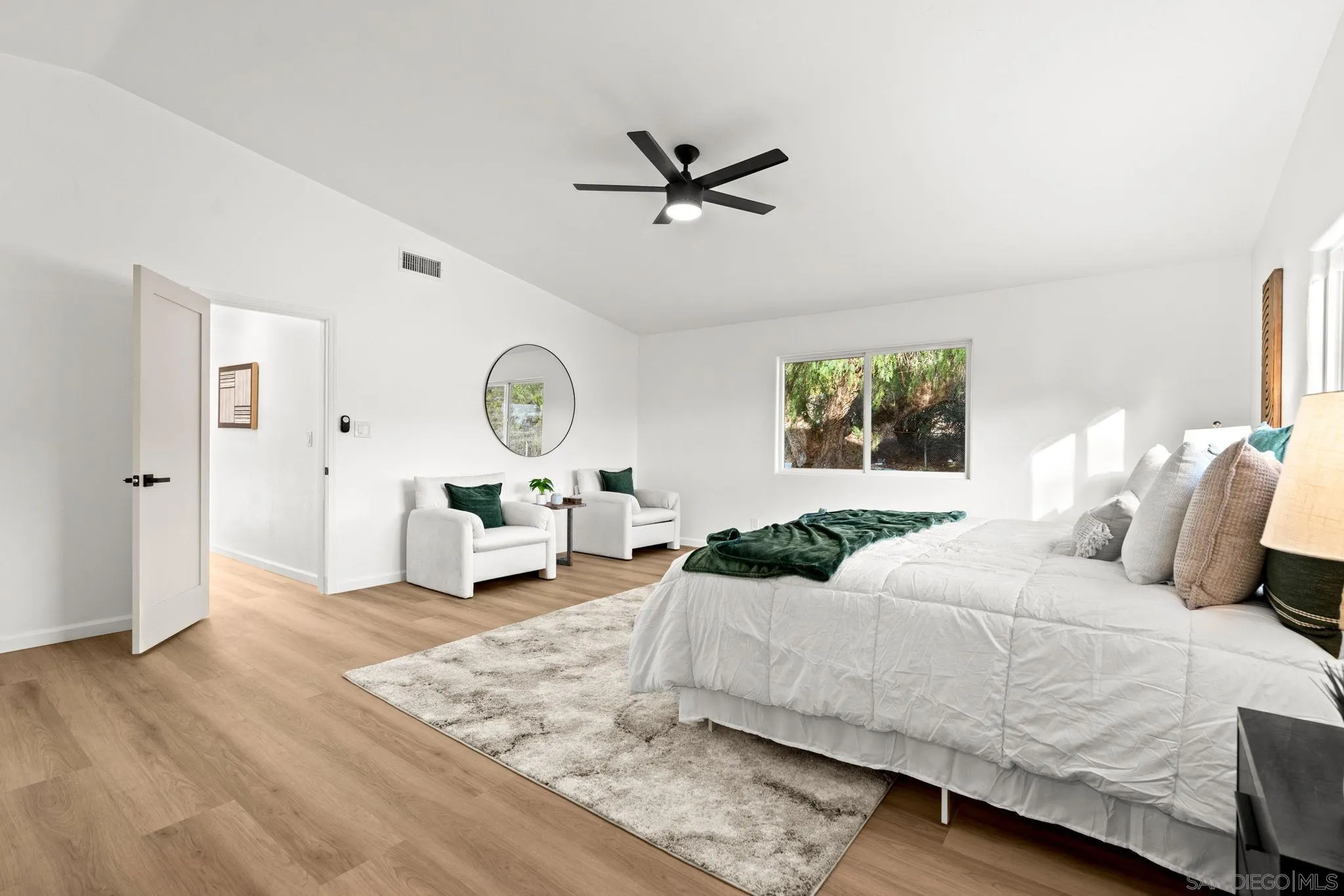 3110 Rio Madre Lane Jamul, CA 91935 - Photo 30 of 48 a bedroom with a large bed and a window