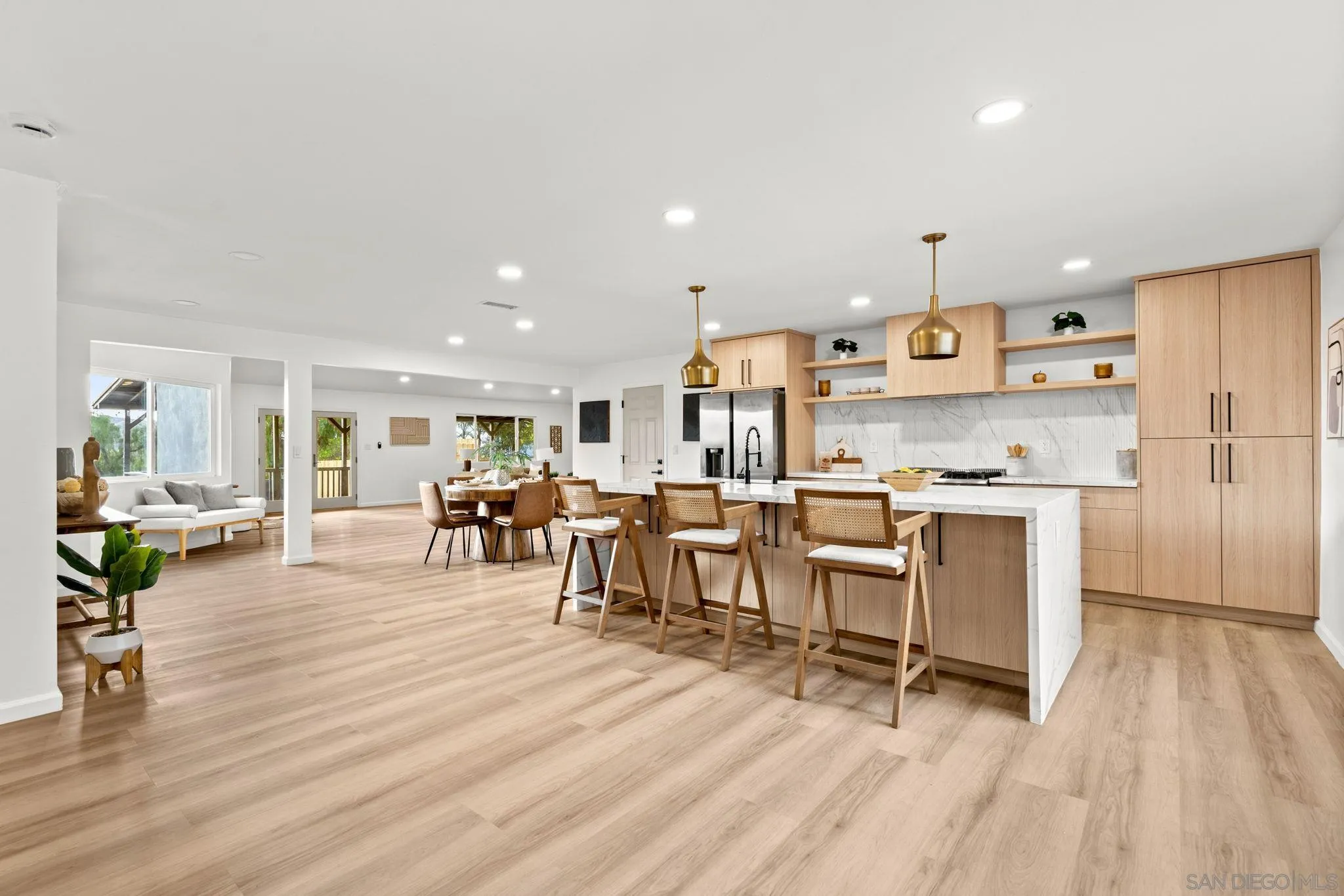 3110 Rio Madre Lane Jamul, CA 91935 - Photo 4 of 48 a open kitchen with white cabinets and stainless steel appliances