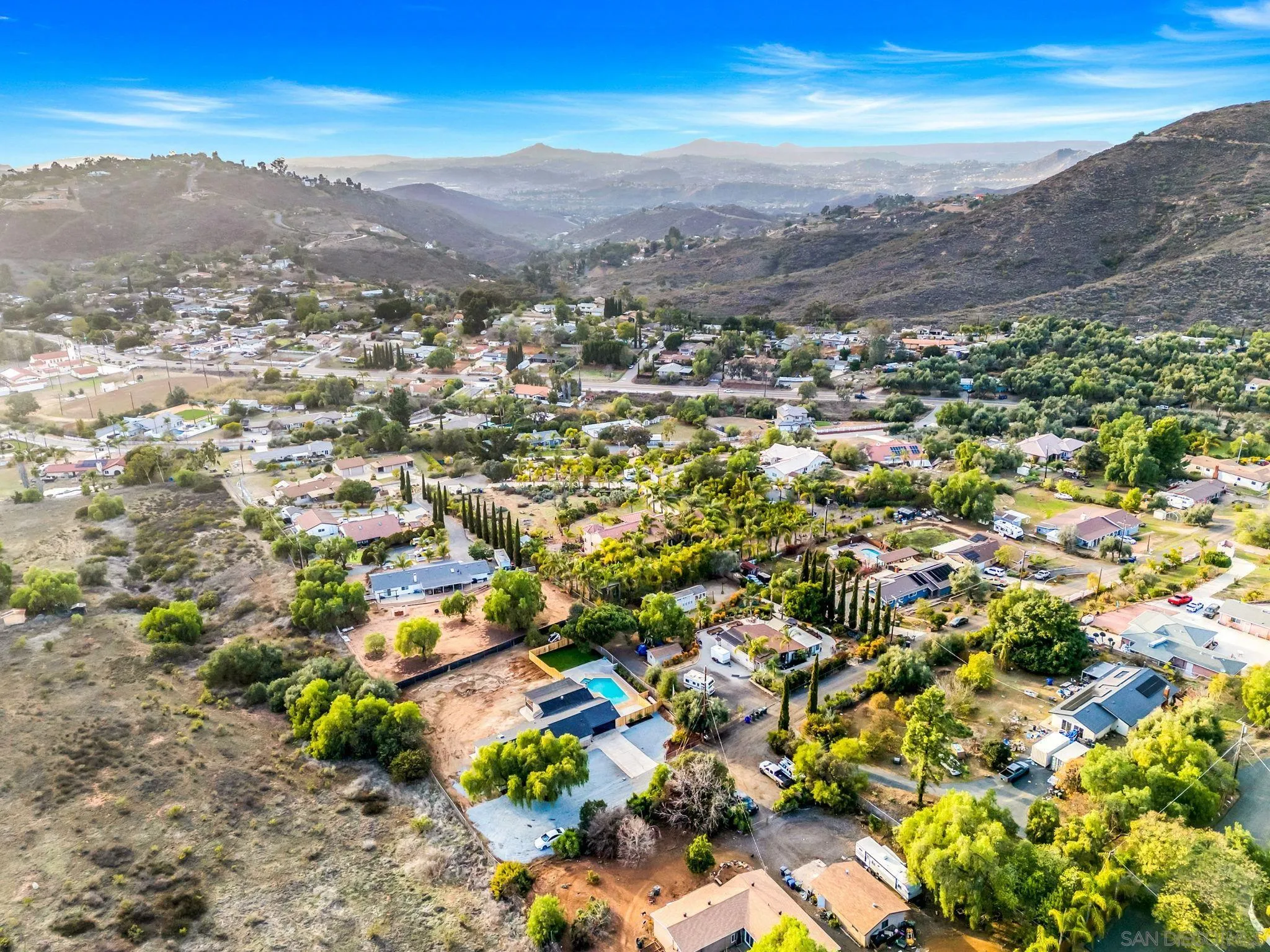 3110 Rio Madre Lane Jamul, CA 91935 - Photo 48 of 48 an aerial view of residential houses with outdoor space and mountain view in back