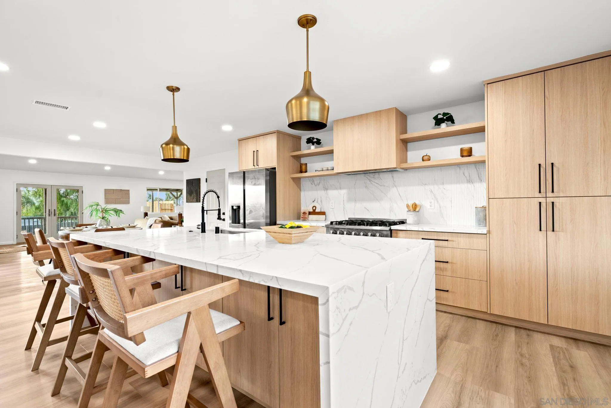 3110 Rio Madre Lane Jamul, CA 91935 - Photo 6 of 48 a kitchen with stainless steel appliances granite countertop a sink a stove and a refrigerator