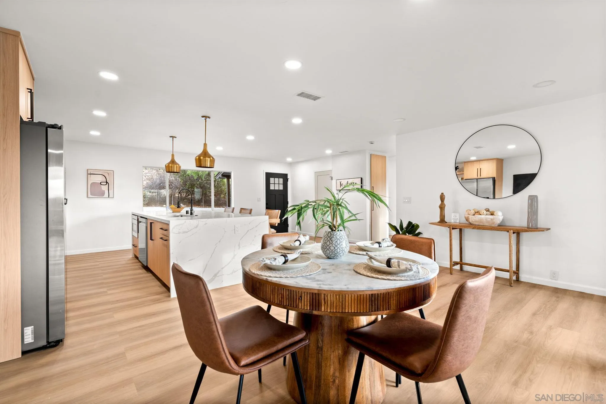 3110 Rio Madre Lane Jamul, CA 91935 - Photo 9 of 48 a view of a dining room with furniture and wooden floor