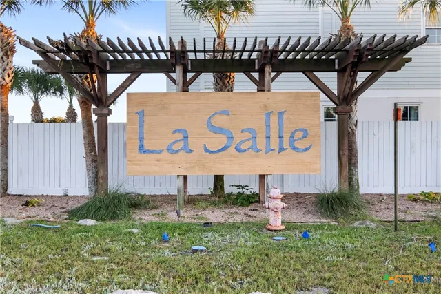 a view of a house with pool and chairs