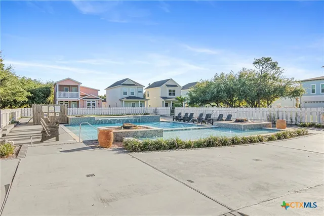 a building outdoor space with patio furniture and potted plants