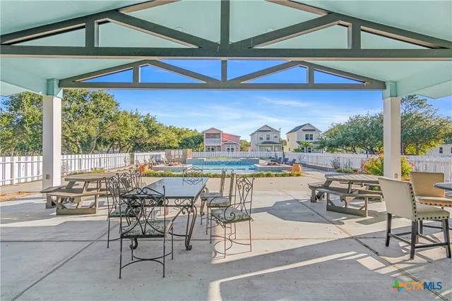 a table and chairs in front of a building