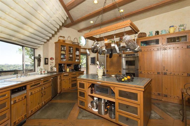 1131 Heatherside Road Pasadena, CA 91105 - Photo 15 of 44 a view of a kitchen with stainless steel appliances granite countertop a stove and a sink