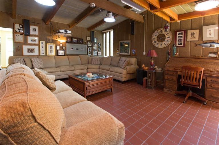 1131 Heatherside Road Pasadena, CA 91105 - Photo 21 of 44 a living room with furniture a clock and a clock