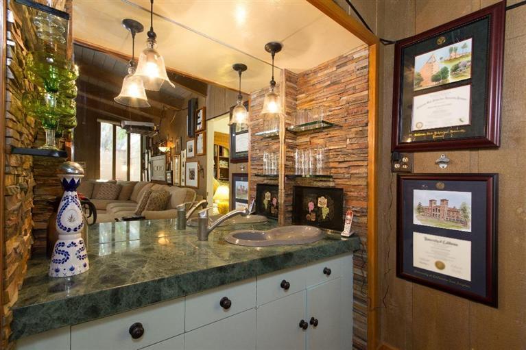 1131 Heatherside Road Pasadena, CA 91105 - Photo 23 of 44 a very nice looking room with a fireplace furniture cabinets and a chandelier