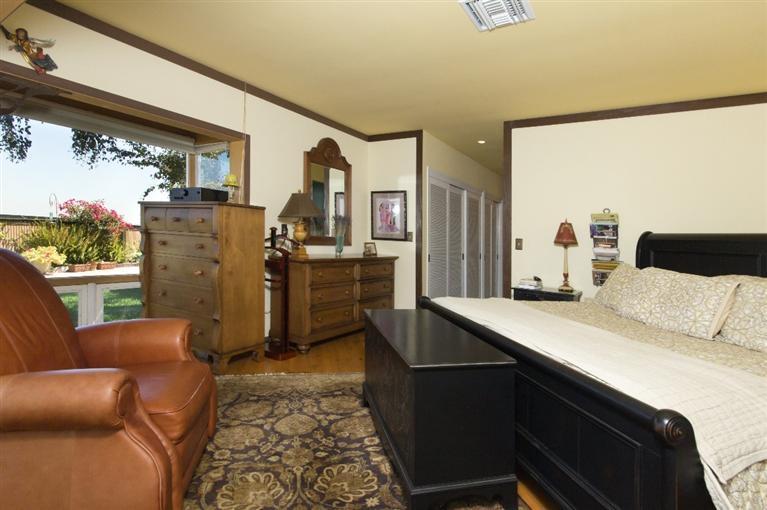 1131 Heatherside Road Pasadena, CA 91105 - Photo 29 of 44 a living room with stainless steel appliances furniture a large window and a kitchen view