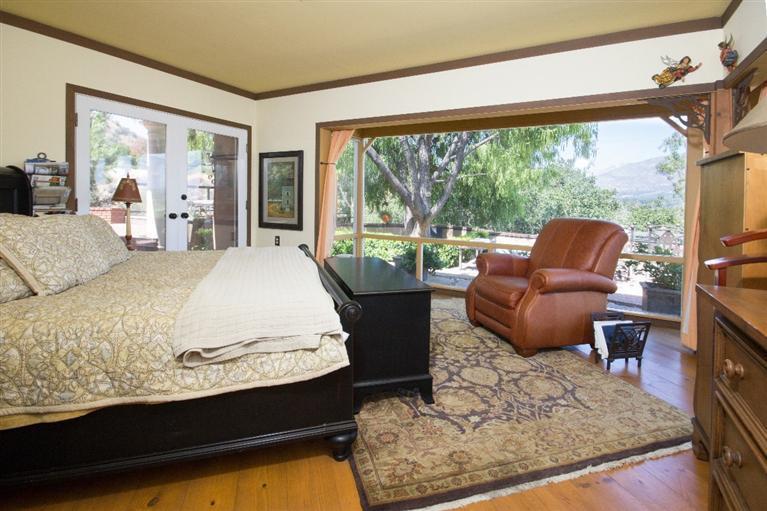1131 Heatherside Road Pasadena, CA 91105 - Photo 34 of 44 a bedroom with a bed and glass window
