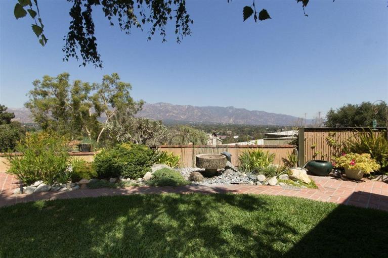 1131 Heatherside Road Pasadena, CA 91105 - Photo 36 of 44 a view of a lake with a mountain in the background