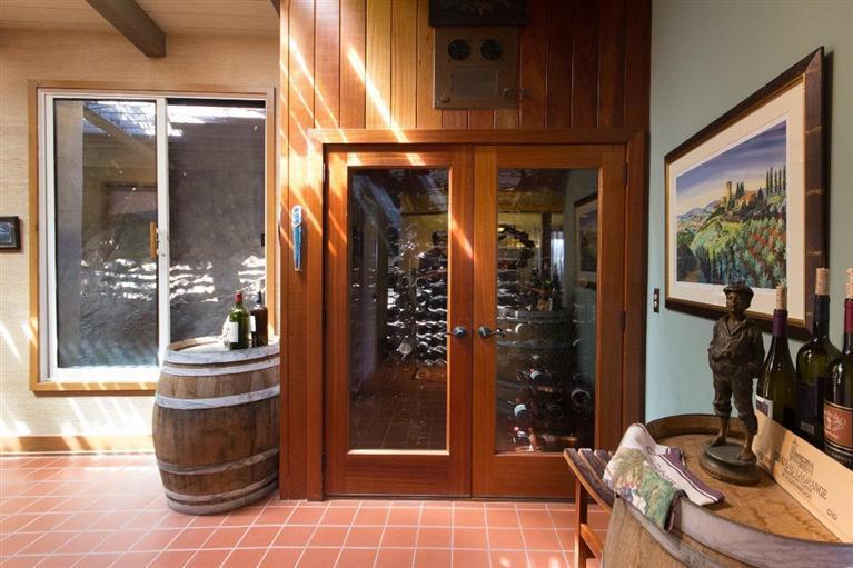 1131 Heatherside Road Pasadena, CA 91105 - Photo 9 of 44 a room with glass door and furniture