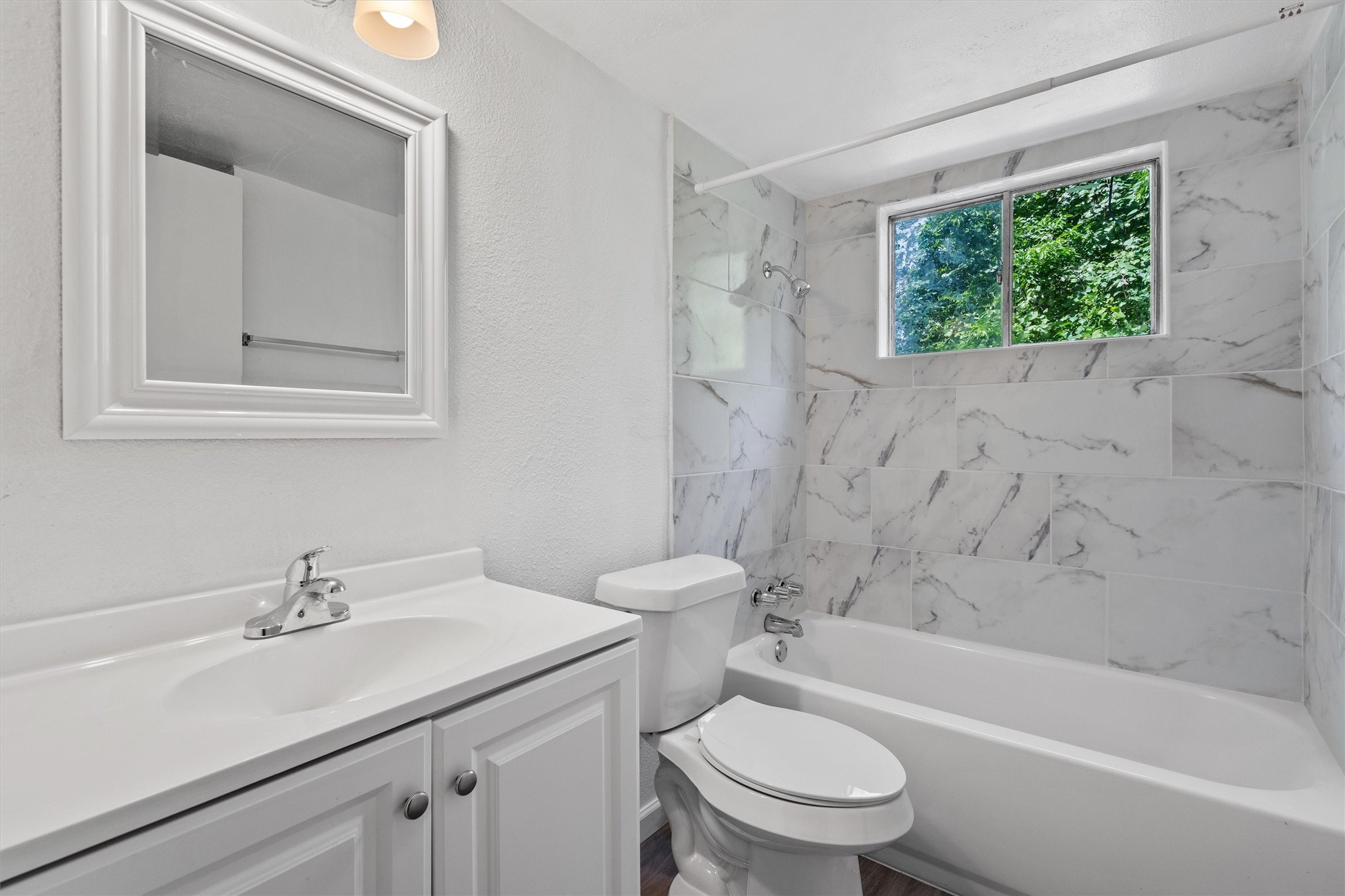 2501 Manor Circle, Unit B Austin, TX 78723 - Photo 14 of 17 a bathroom with a sink toilet and a bathtub