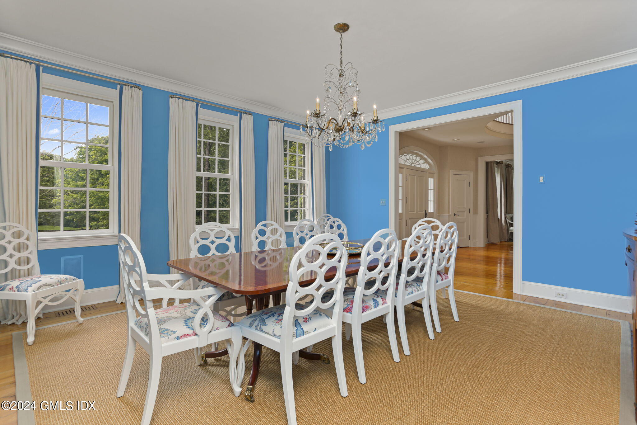 68 Rock Maple Road Greenwich, CT 06830 - Photo 13 of 46 a dining room with furniture a chandelier and a rug