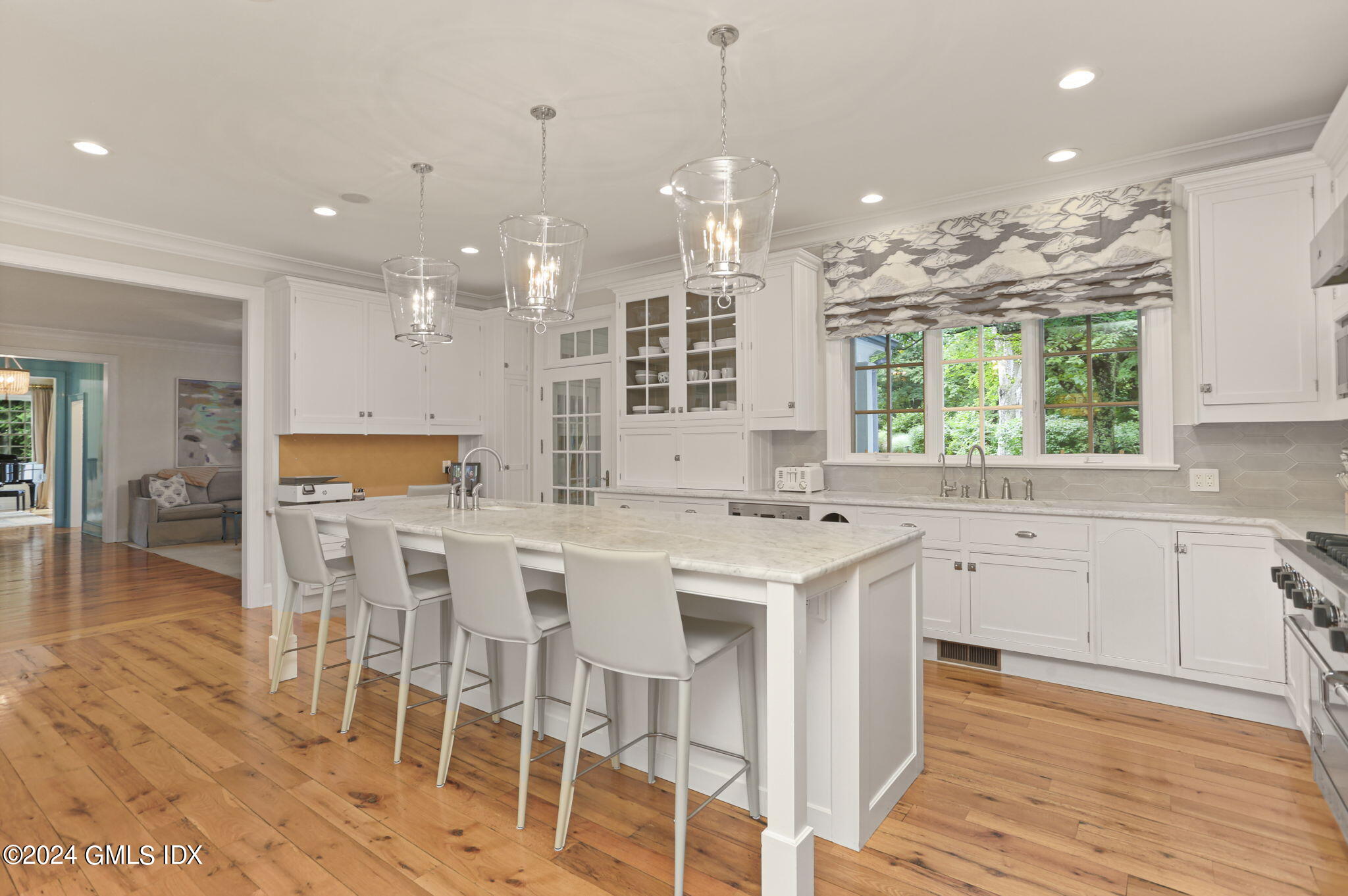 68 Rock Maple Road Greenwich, CT 06830 - Photo 15 of 46 a large kitchen with kitchen island granite countertop a large island in the center and stainless steel appliances