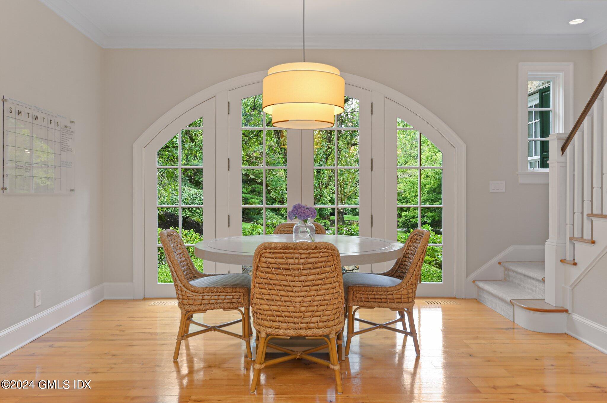68 Rock Maple Road Greenwich, CT 06830 - Photo 17 of 46 a view of a dining room with furniture window and wooden floor
