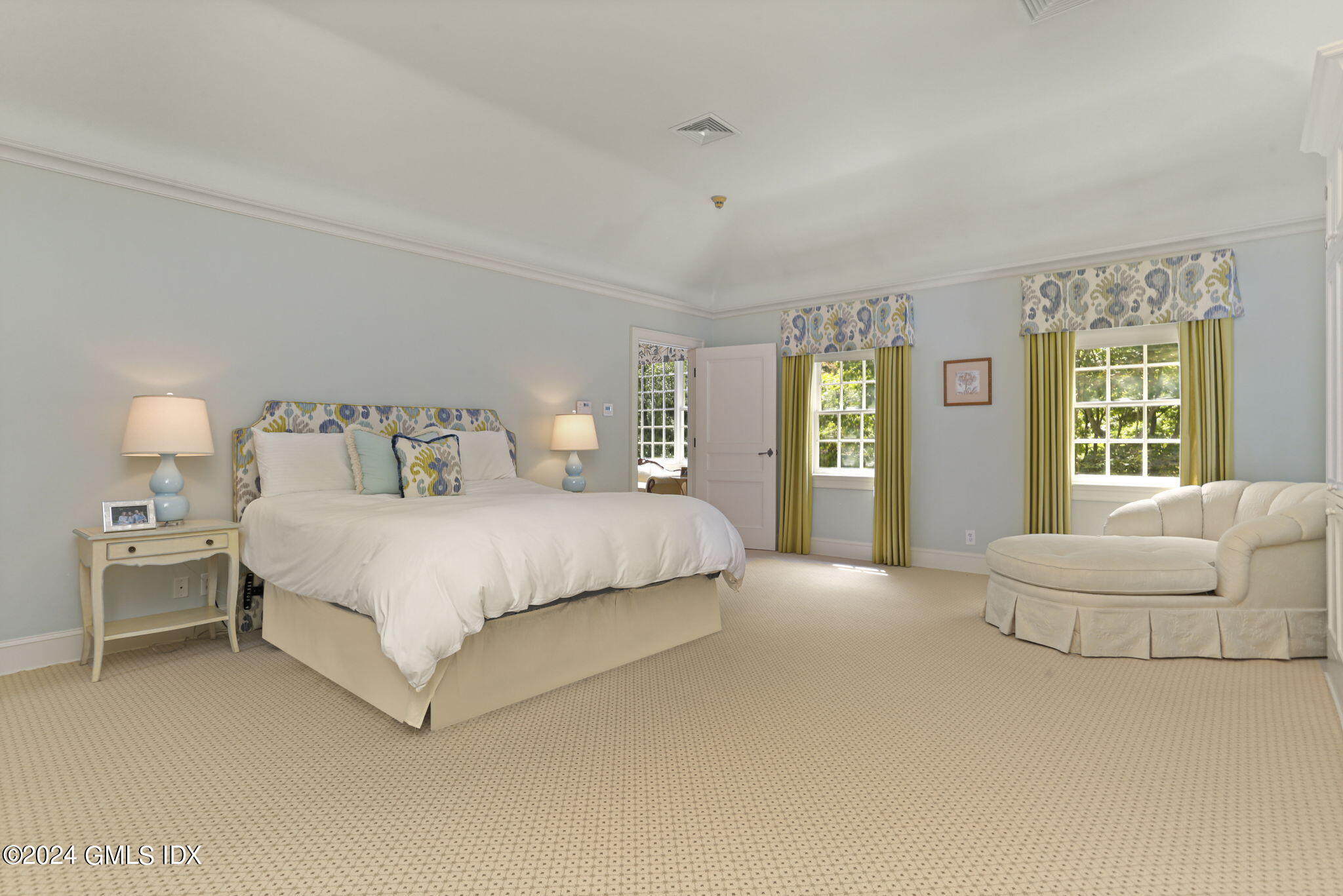 68 Rock Maple Road Greenwich, CT 06830 - Photo 23 of 46 a spacious bedroom with a bed and a couch