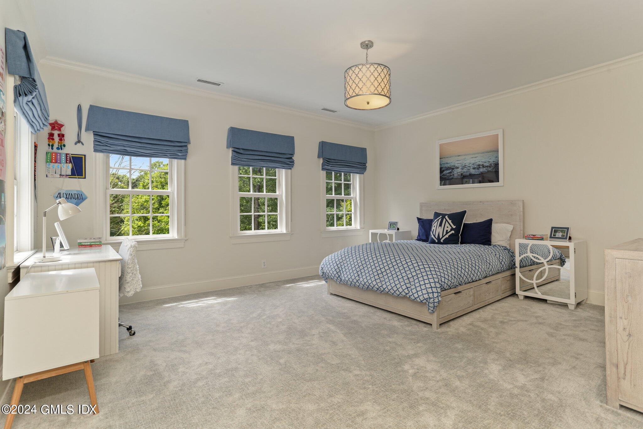 68 Rock Maple Road Greenwich, CT 06830 - Photo 25 of 46 a bedroom with a bed and a window