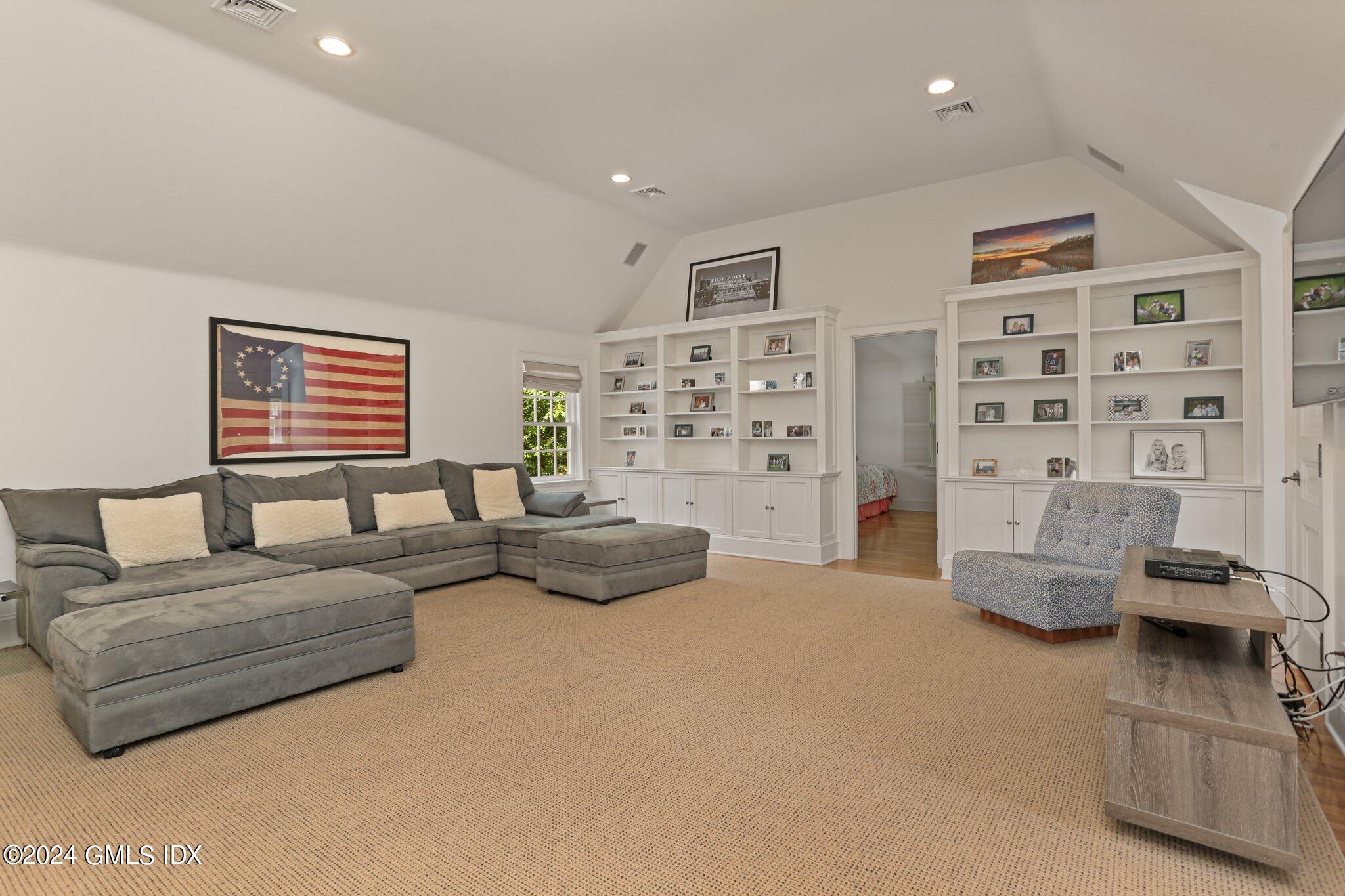 68 Rock Maple Road Greenwich, CT 06830 - Photo 30 of 46 a living room with furniture and a large window