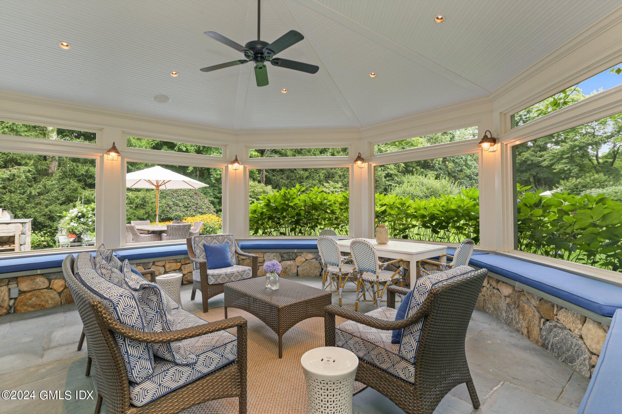 68 Rock Maple Road Greenwich, CT 06830 - Photo 33 of 46 a living room with furniture and a large window