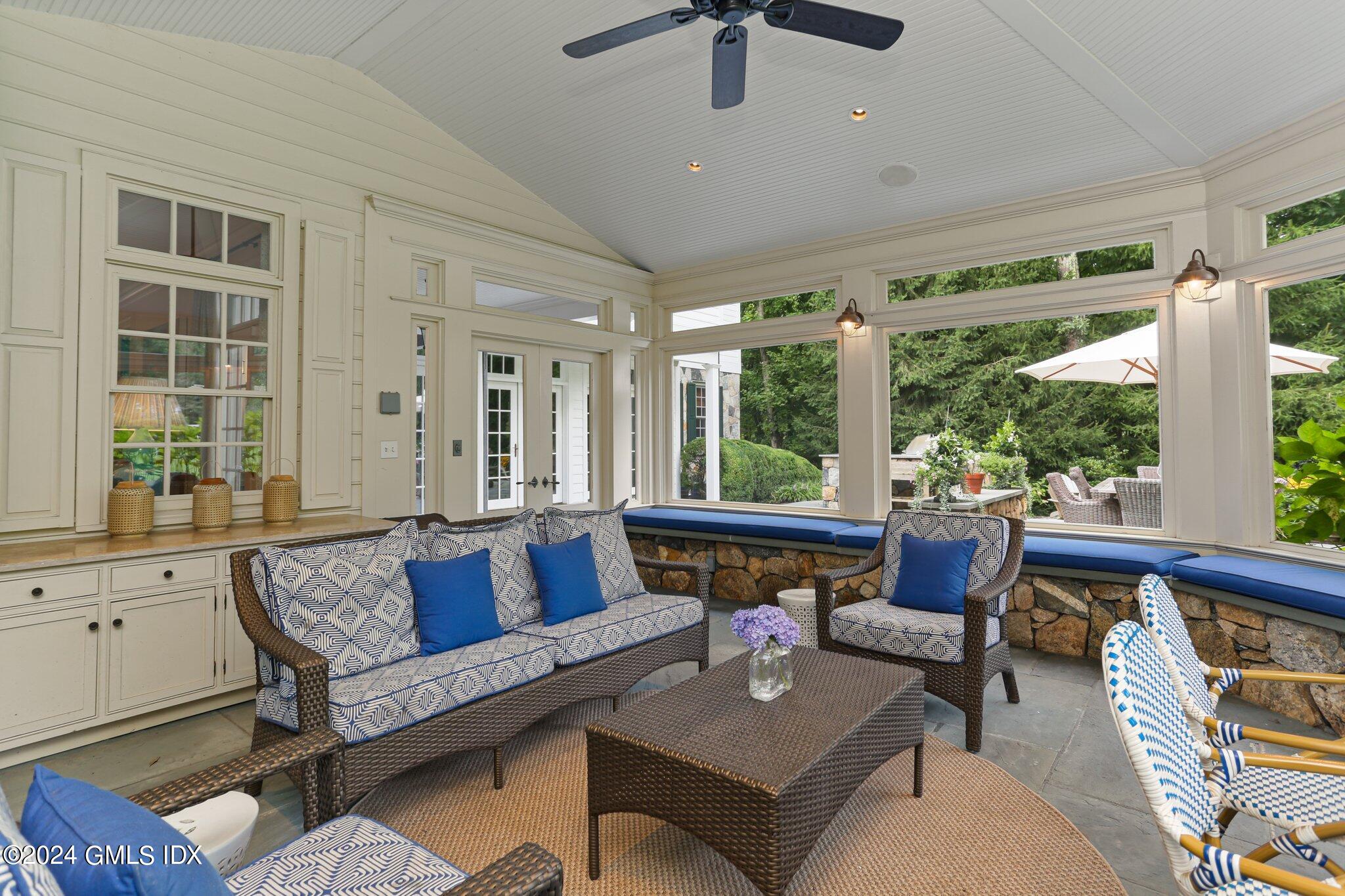 68 Rock Maple Road Greenwich, CT 06830 - Photo 34 of 46 a living room with furniture and a large window