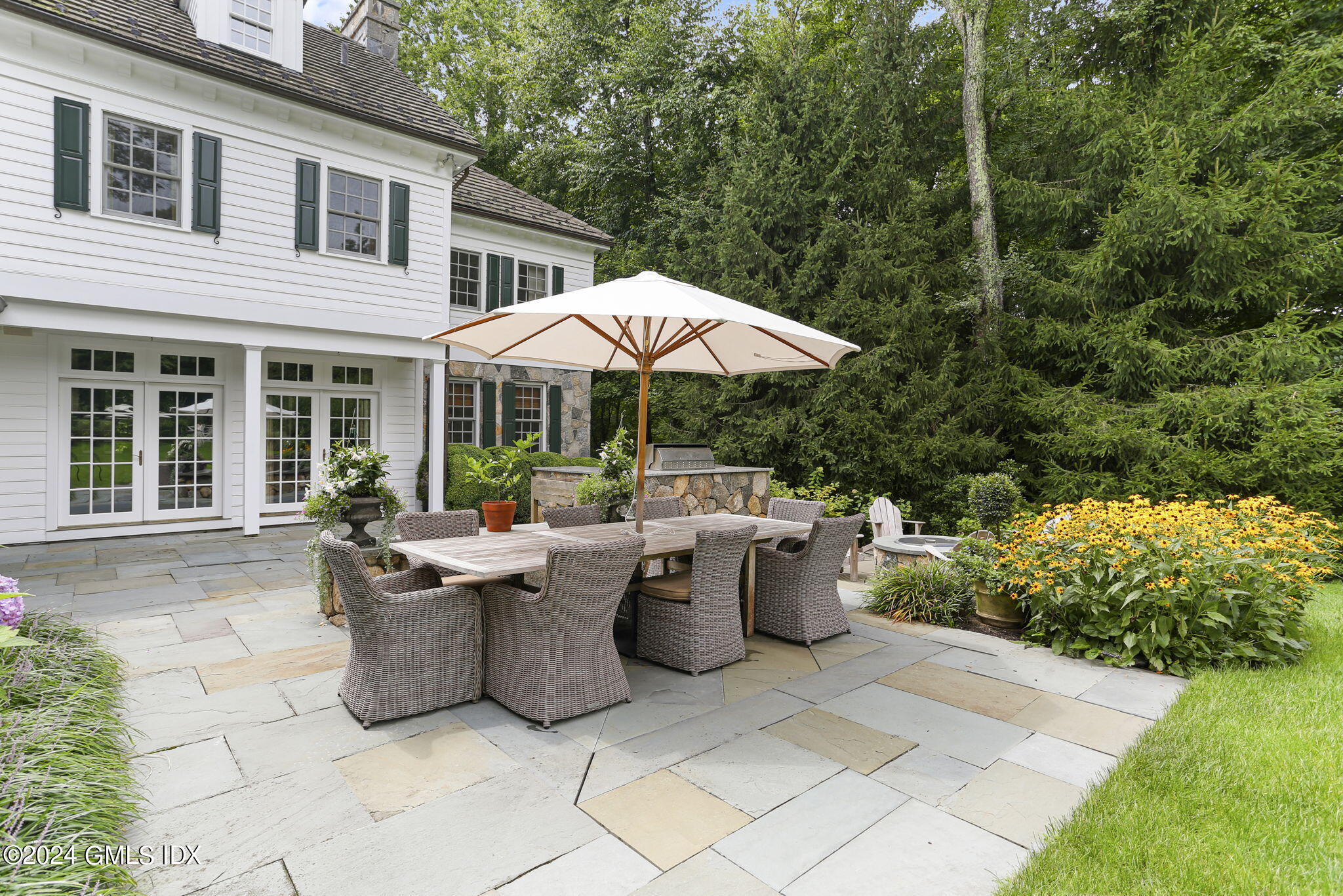 68 Rock Maple Road Greenwich, CT 06830 - Photo 36 of 46 a view of a patio with chairs and plants