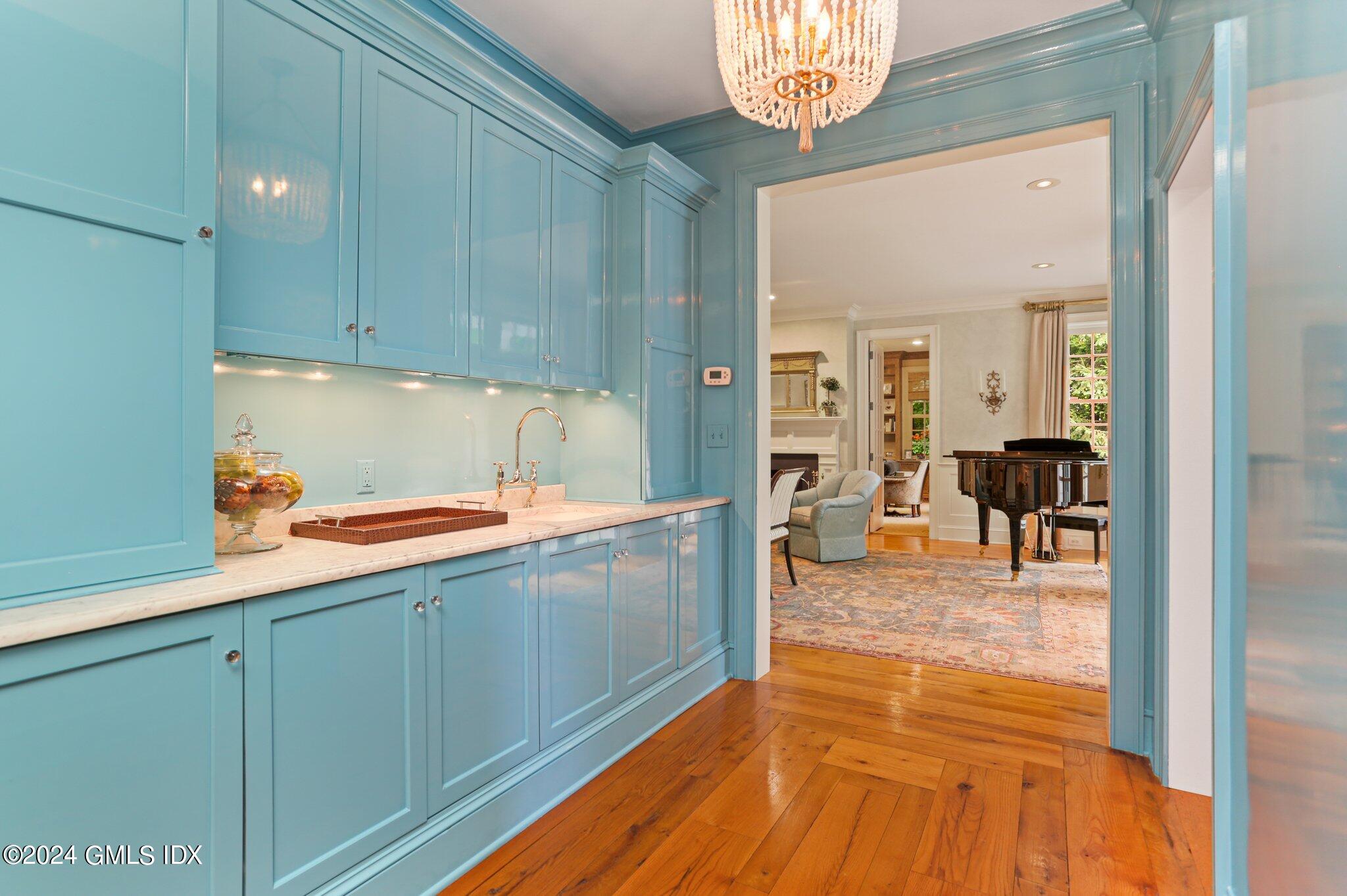 68 Rock Maple Road Greenwich, CT 06830 - Photo 8 of 46 a view of a kitchen with kitchen island white cabinets and stainless steel appliances