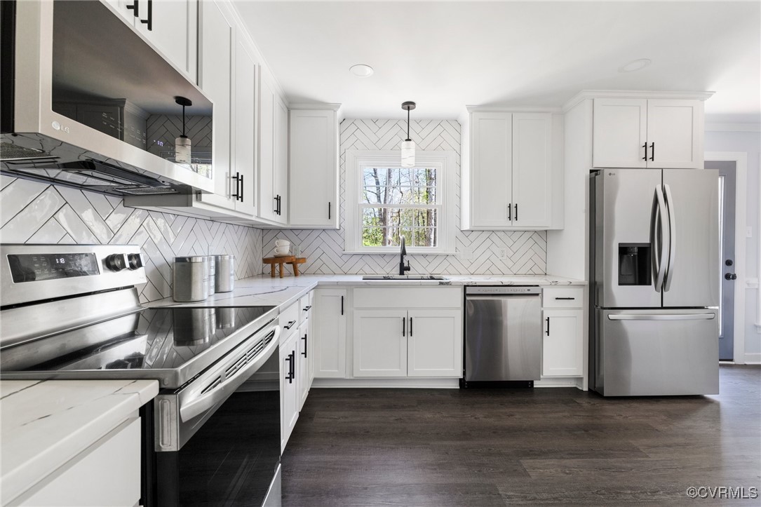 341 Rossmere Drive Midlothian, VA 23114 - Photo 11 of 41 a kitchen with a white cabinets and white appliances