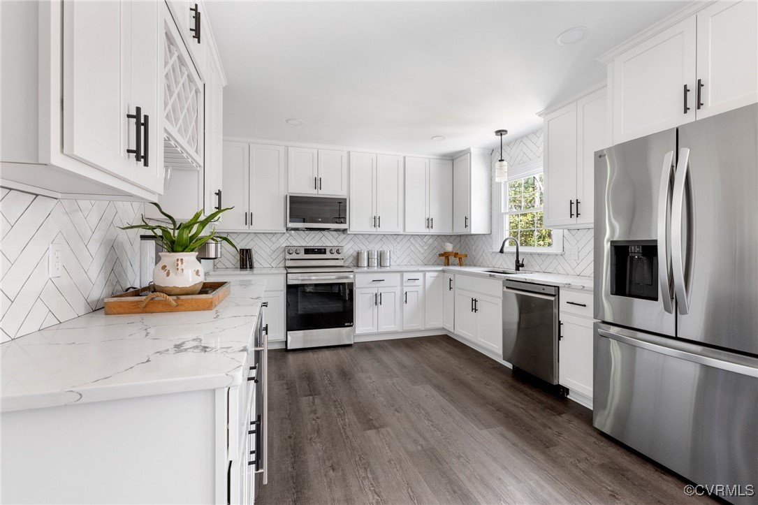 341 Rossmere Drive Midlothian, VA 23114 - Photo 14 of 41 a kitchen with white cabinets stainless steel appliances and a window