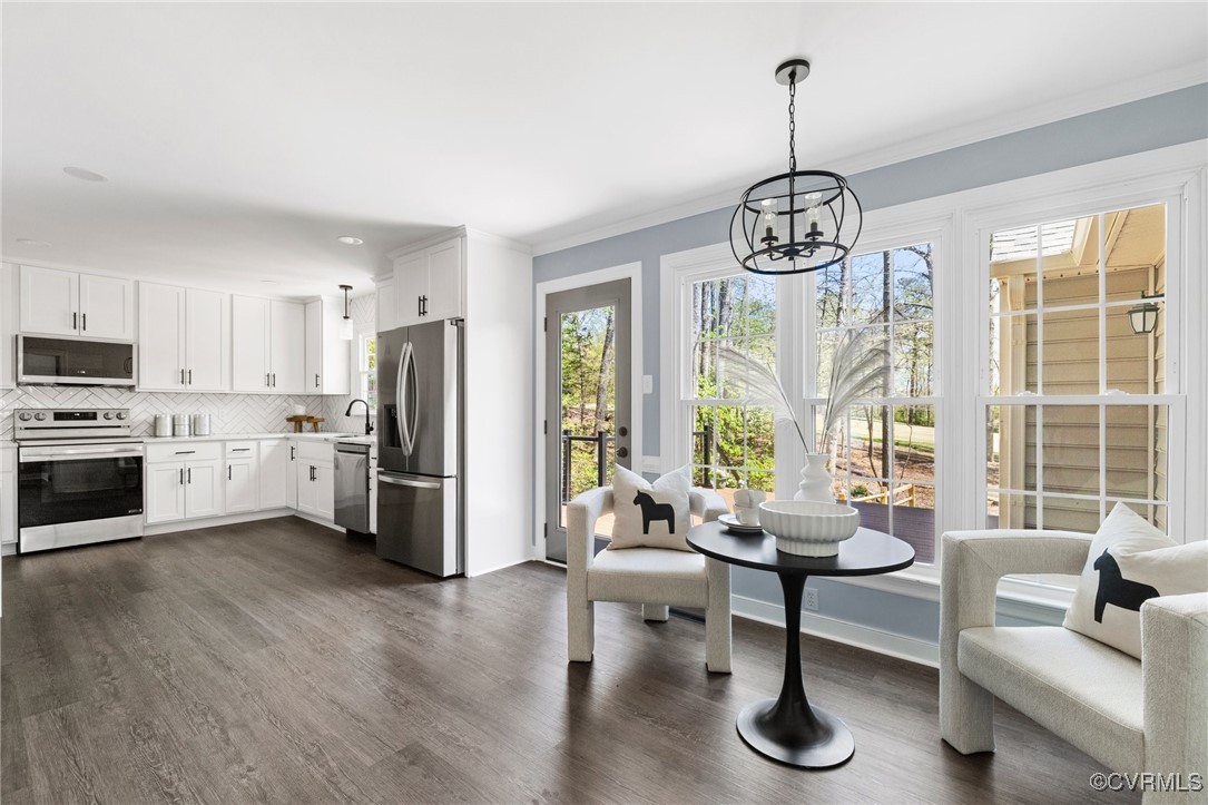 341 Rossmere Drive Midlothian, VA 23114 - Photo 16 of 41 a living room with stainless steel appliances granite countertop furniture and a chandelier