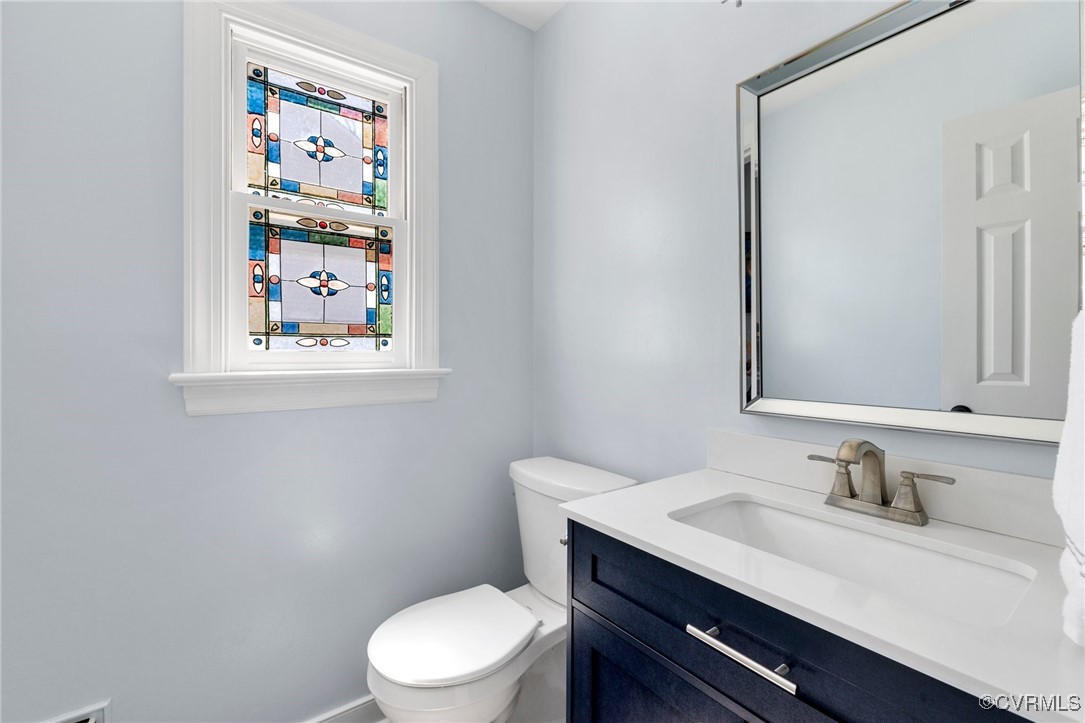 341 Rossmere Drive Midlothian, VA 23114 - Photo 21 of 41 a bathroom with a toilet a sink and mirror