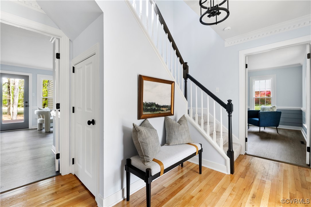 341 Rossmere Drive Midlothian, VA 23114 - Photo 5 of 41 a view of a hallway with wooden floor and stairs