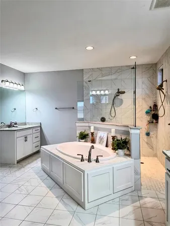 a kitchen with a white stove top oven and cabinets