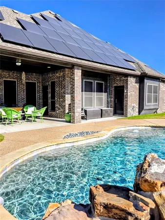 a view of a house with a swimming pool