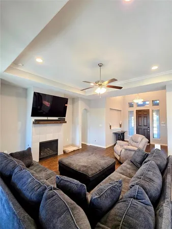 a living room with furniture and a fireplace