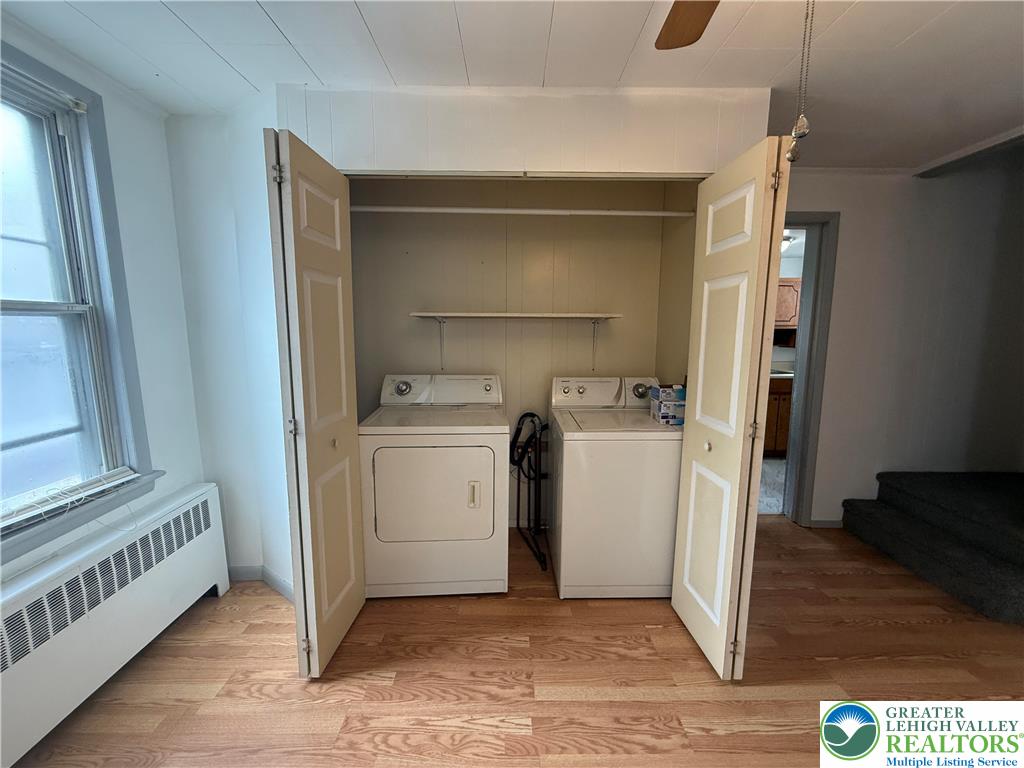 27 West Allen Street Allentown, PA 18102 - Photo 7 of 15 a utility room with cabinets washer and dryer