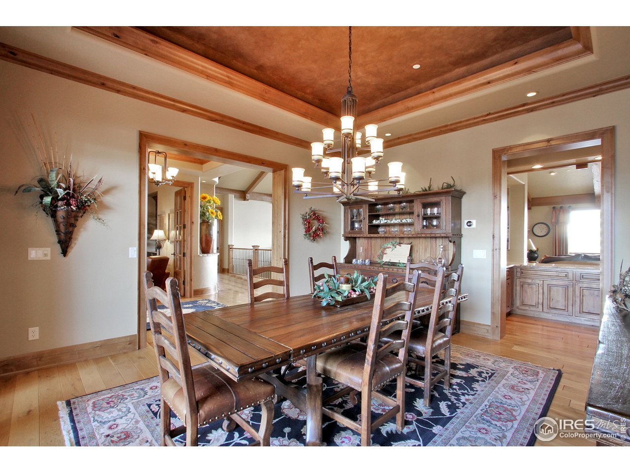 9455 Crystal Lane Longmont, CO 80503 - Photo 12 of 40 a view of a dining room with furniture and wooden floor