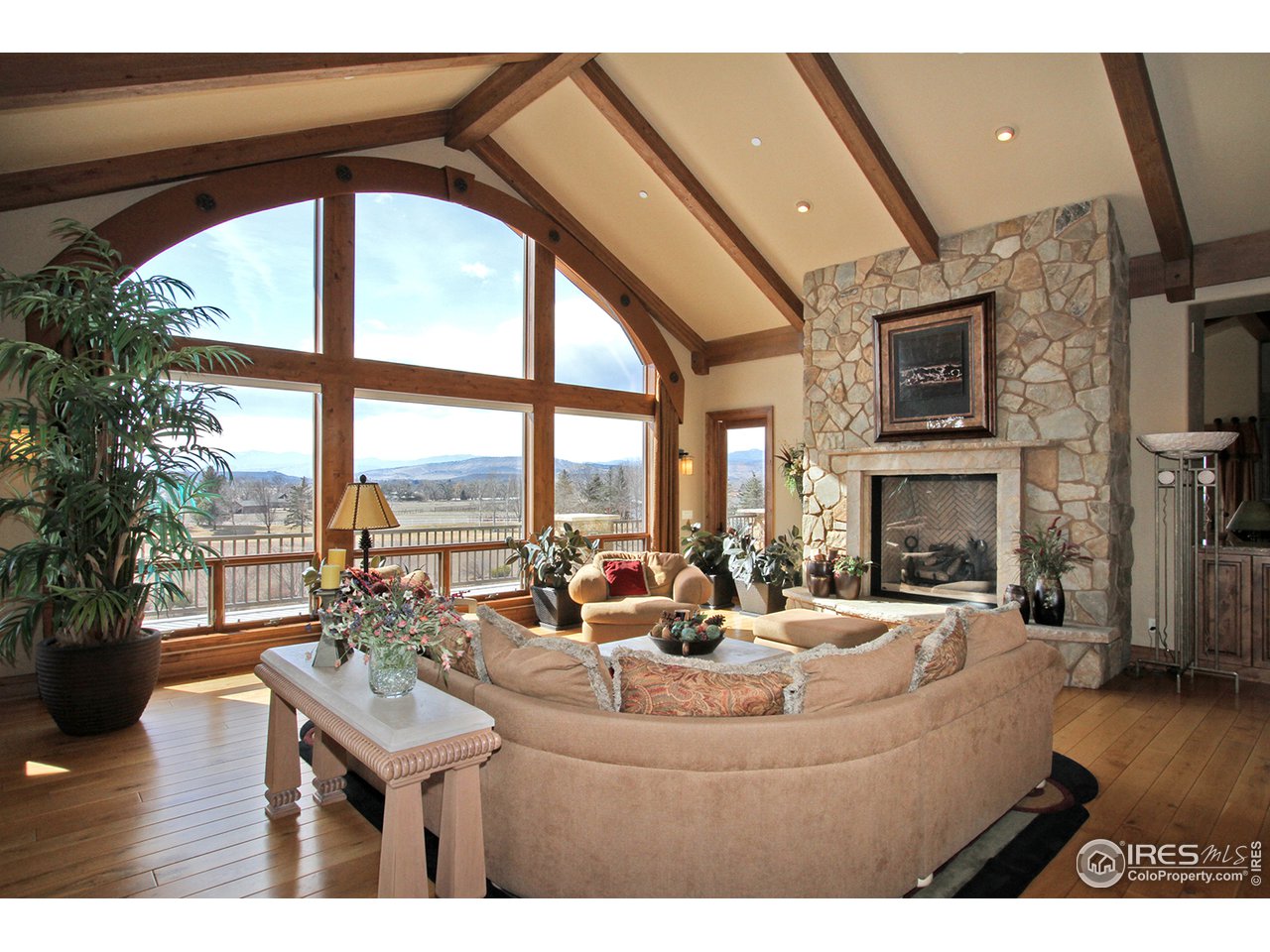 9455 Crystal Lane Longmont, CO 80503 - Photo 14 of 40 a living room with fireplace furniture and a large window