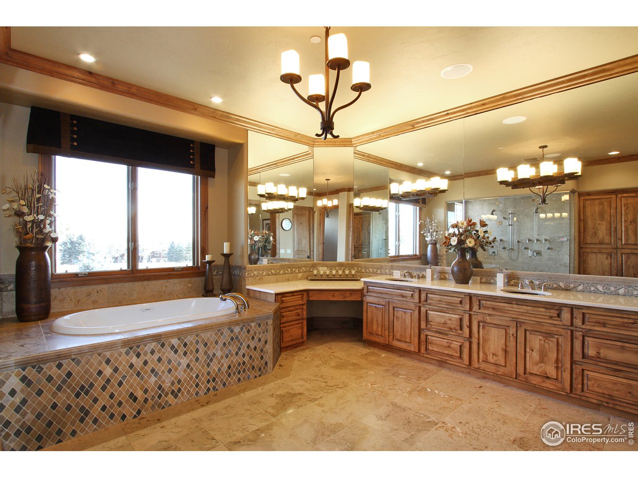 9455 Crystal Lane Longmont, CO 80503 - Photo 19 of 40 a large bathroom with a large tub and sink