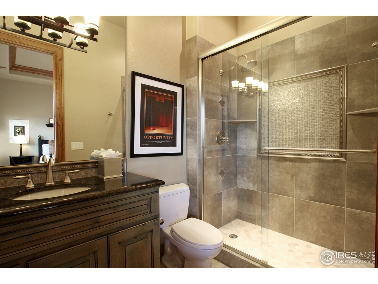 9455 Crystal Lane Longmont, CO 80503 - Photo 25 of 40 a bathroom with a sink and a mirror