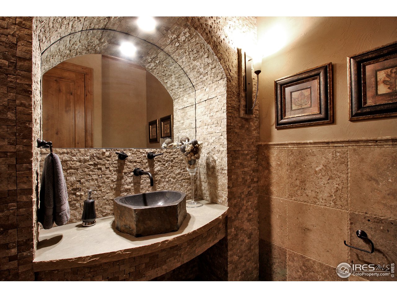 9455 Crystal Lane Longmont, CO 80503 - Photo 29 of 40 a view of a bathroom with a sink and a mirror