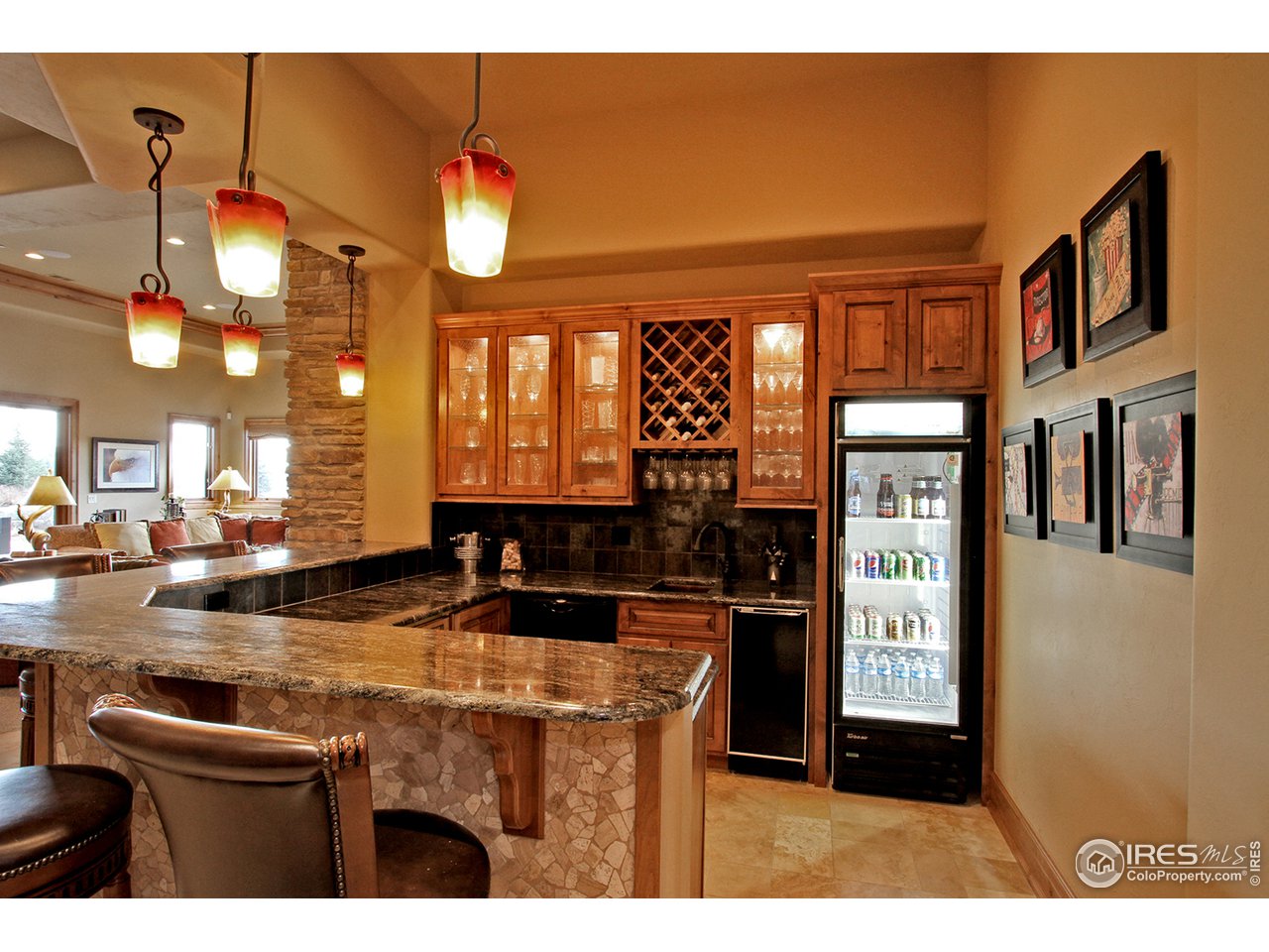 9455 Crystal Lane Longmont, CO 80503 - Photo 36 of 40 a kitchen area with granite countertop a sink and cabinets