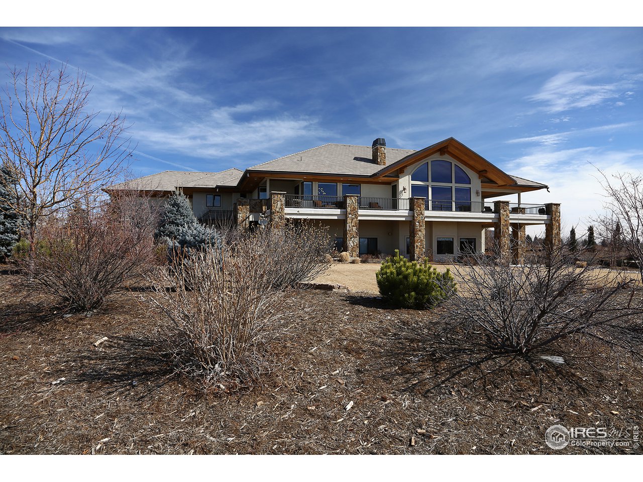 9455 Crystal Lane Longmont, CO 80503 - Photo 5 of 40 a front view of a house with a yard