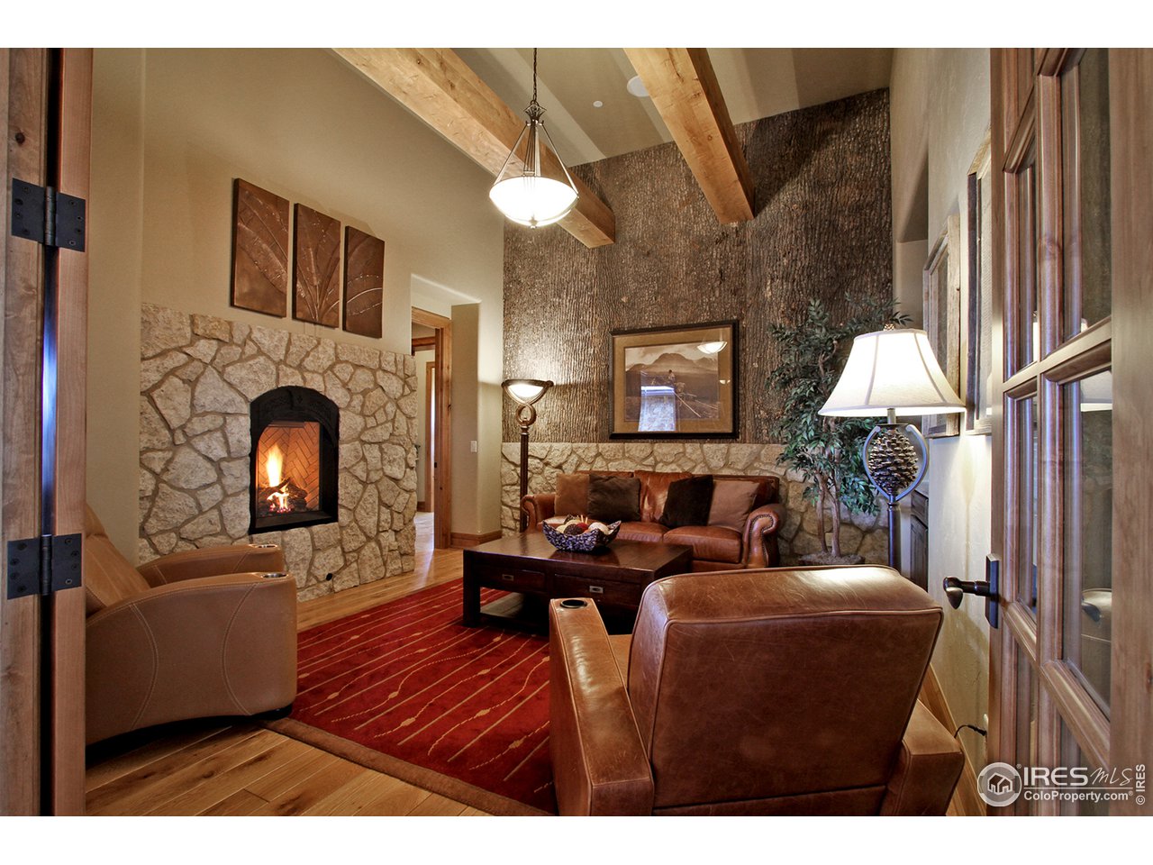9455 Crystal Lane Longmont, CO 80503 - Photo 7 of 40 a living room with furniture and a fireplace