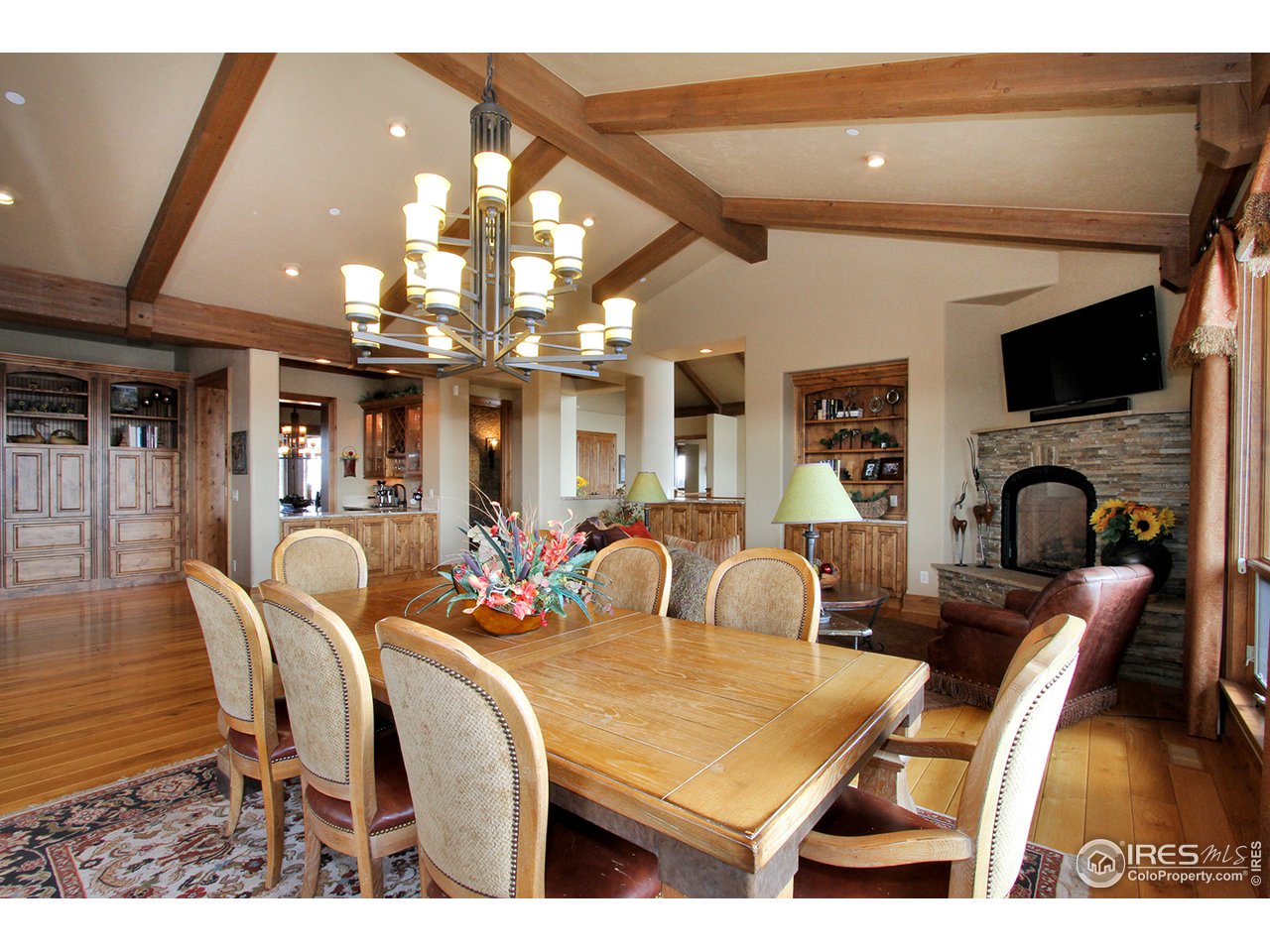 9455 Crystal Lane Longmont, CO 80503 - Photo 10 of 40 a room with lots of chairs and a flat screen tv